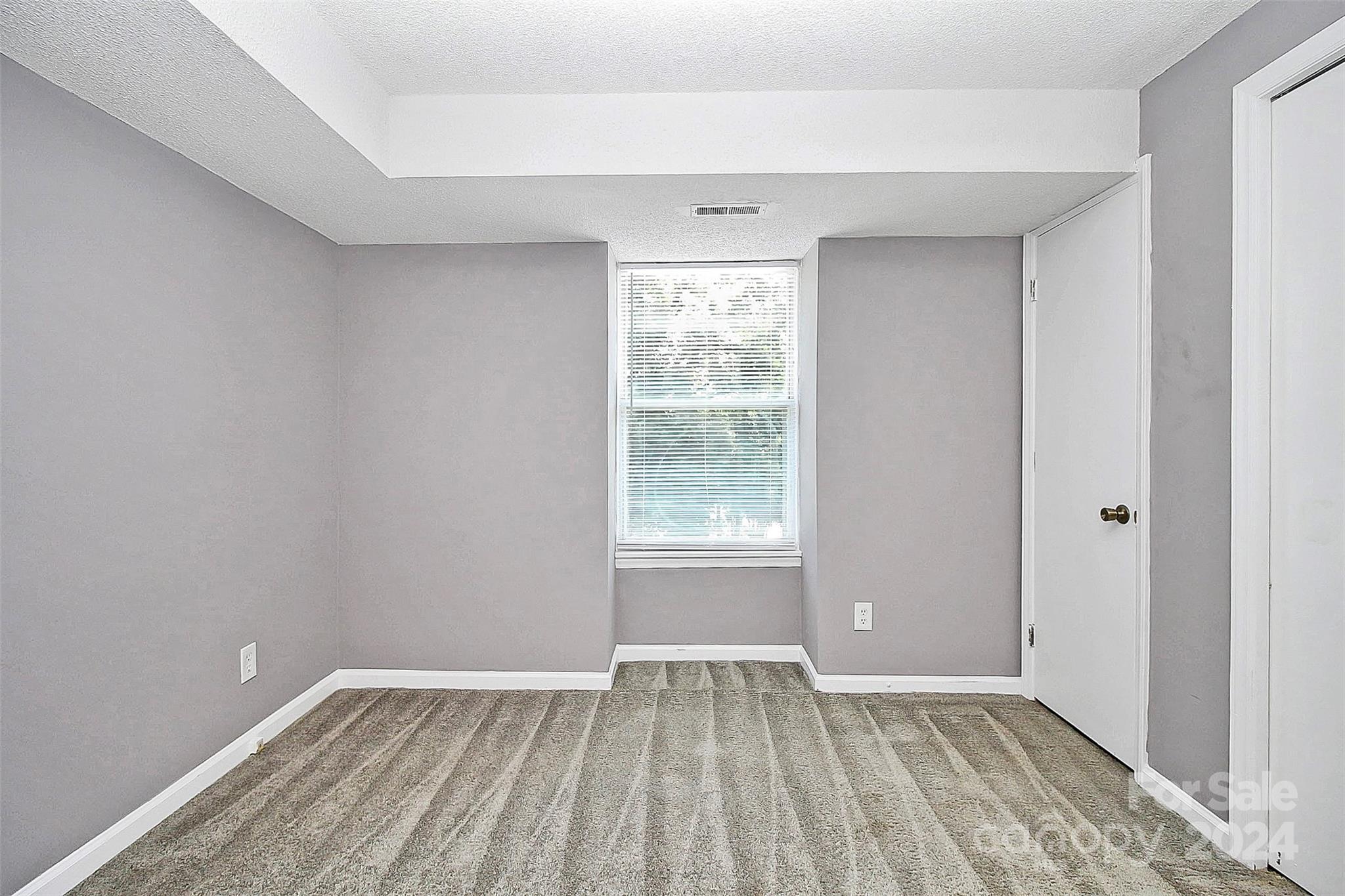 9409 Old Concord Road, Unit M Charlotte, NC 28213 - Photo 21 of 29 an empty room with window