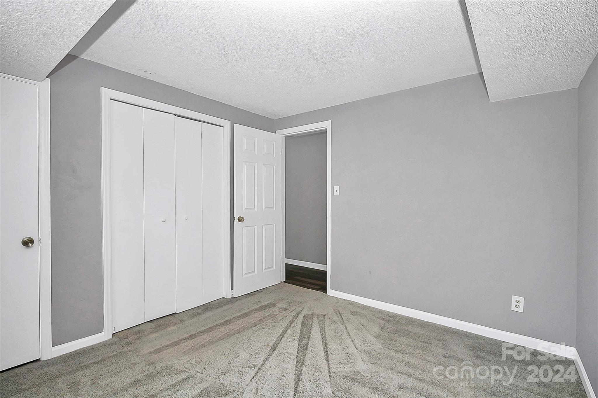 9409 Old Concord Road, Unit M Charlotte, NC 28213 - Photo 23 of 29 a view of an empty room
