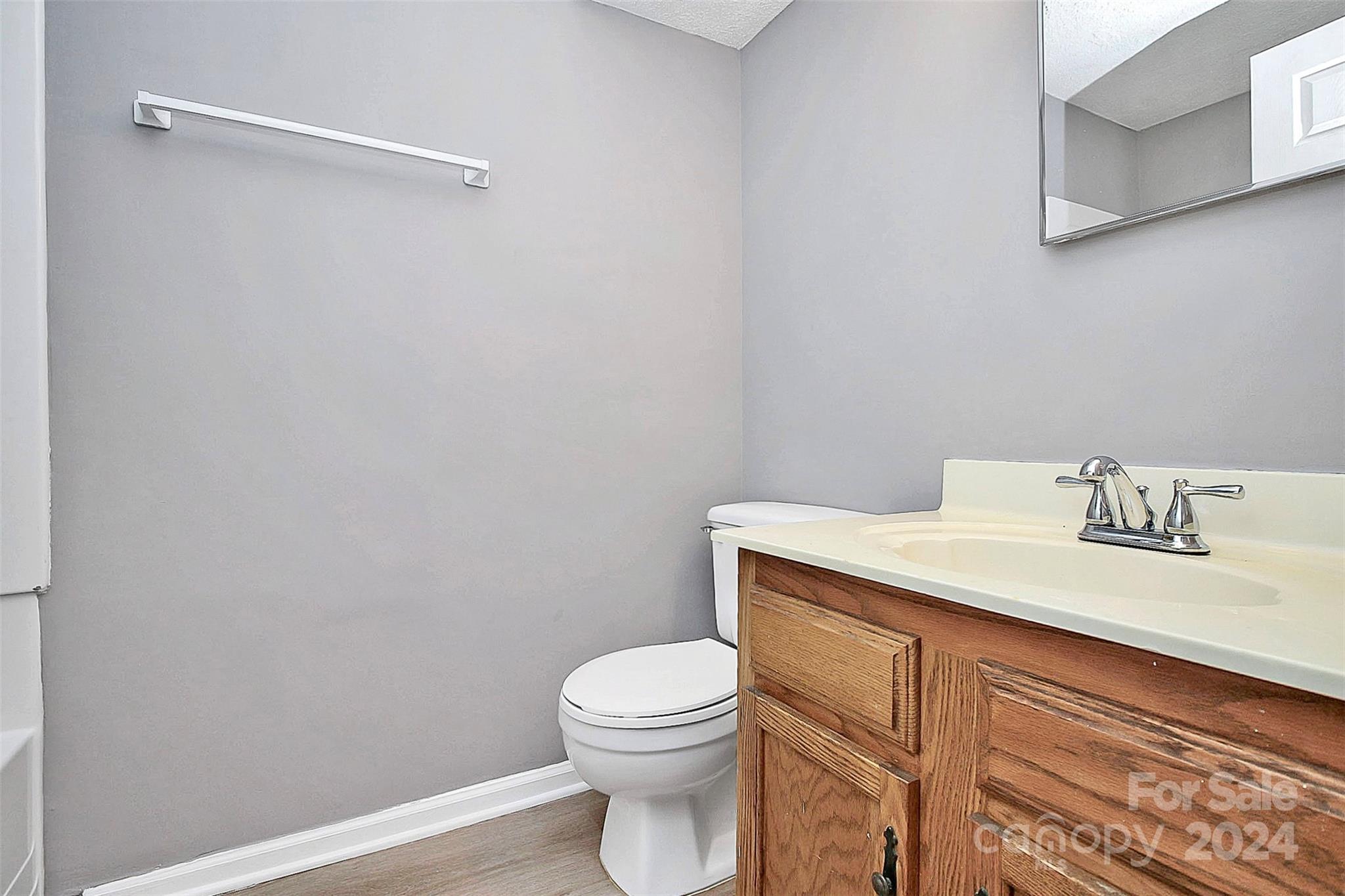9409 Old Concord Road, Unit M Charlotte, NC 28213 - Photo 27 of 29 a bathroom with a granite countertop toilet and a sink
