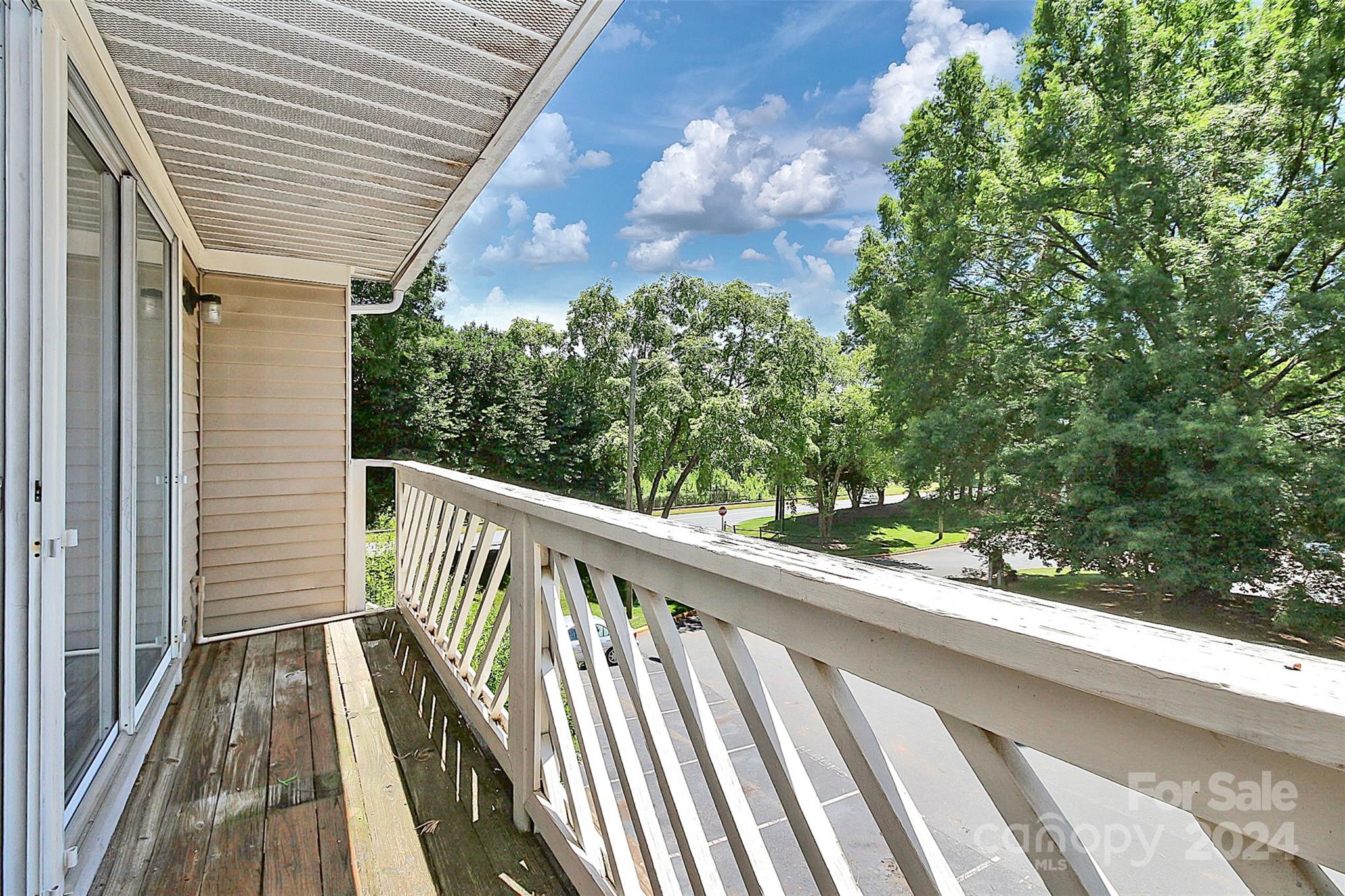 9409 Old Concord Road, Unit M Charlotte, NC 28213 - Photo 29 of 29 a view of balcony with wooden floor