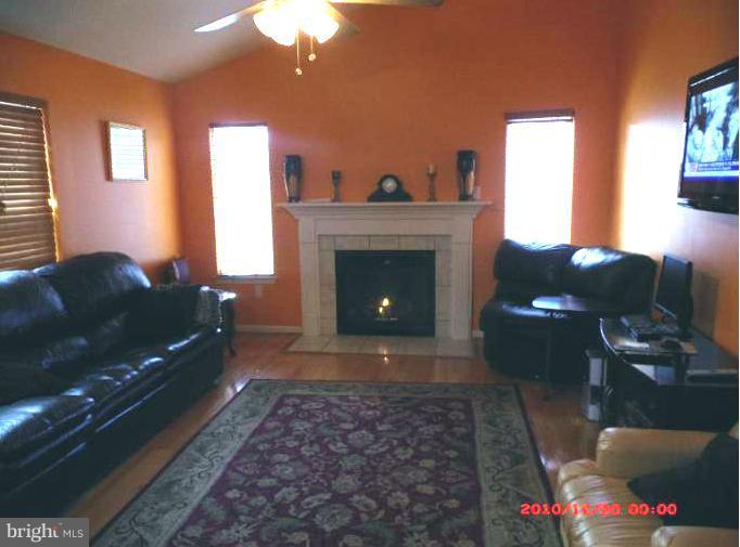 7013 Friendship Road Clinton, MD 20735 - Photo 11 of 15 a living room with furniture and a fireplace