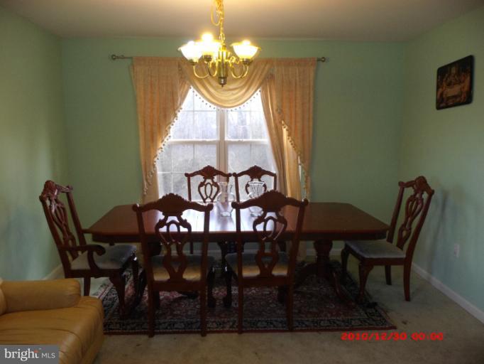 7013 Friendship Road Clinton, MD 20735 - Photo 3 of 15 a view of a dining room with furniture