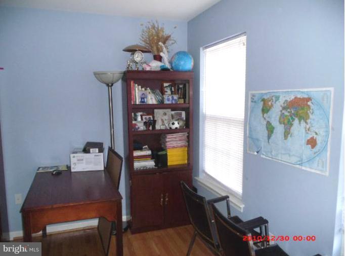 7013 Friendship Road Clinton, MD 20735 - Photo 6 of 15 a view of a dining room with furniture wooden floor and a window