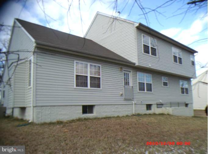7013 Friendship Road Clinton, MD 20735 - Photo 10 of 15 a front view of a house with a yard