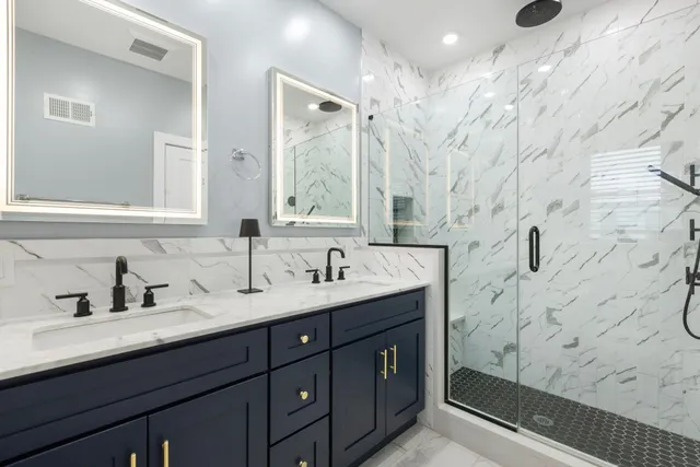 a bathroom with a sink double vanity and a mirror