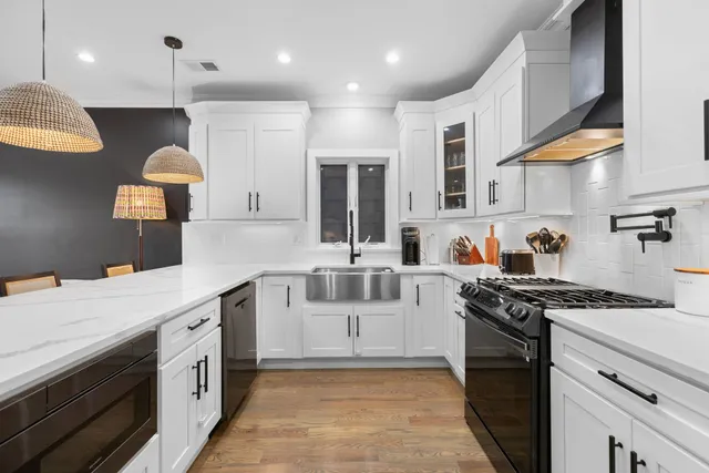 a kitchen with a stove and a sink