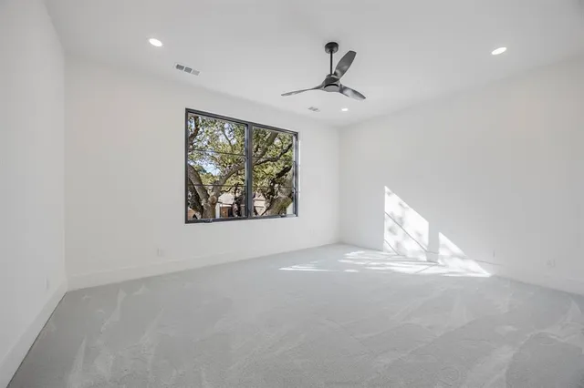 a bathroom with a double vanity sink a toilet and shower