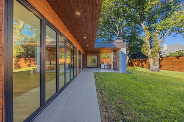 an empty room with windows and entrance