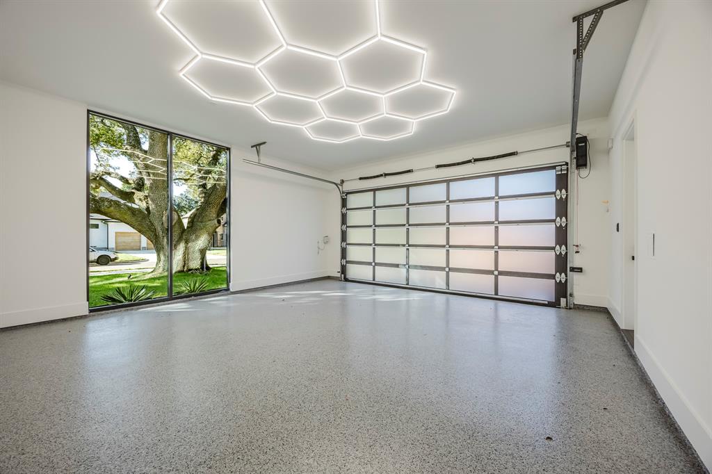 5723 Meletio Lane Dallas, TX 75230 - Photo 38 of 38 Garage with baseboards