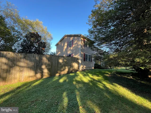 a view of a lake with a house in the background