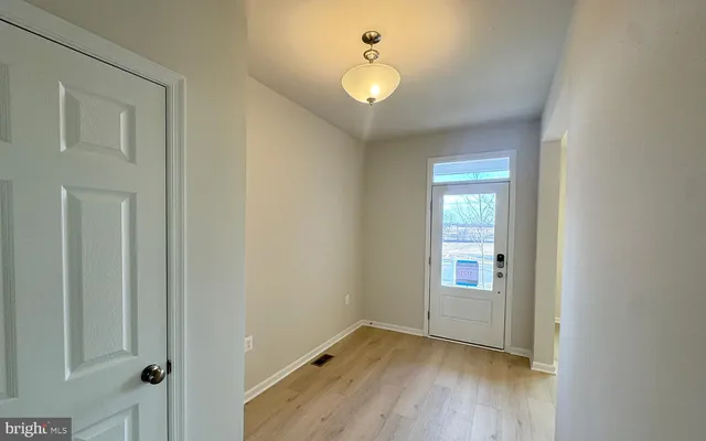 an empty room that has a window in it