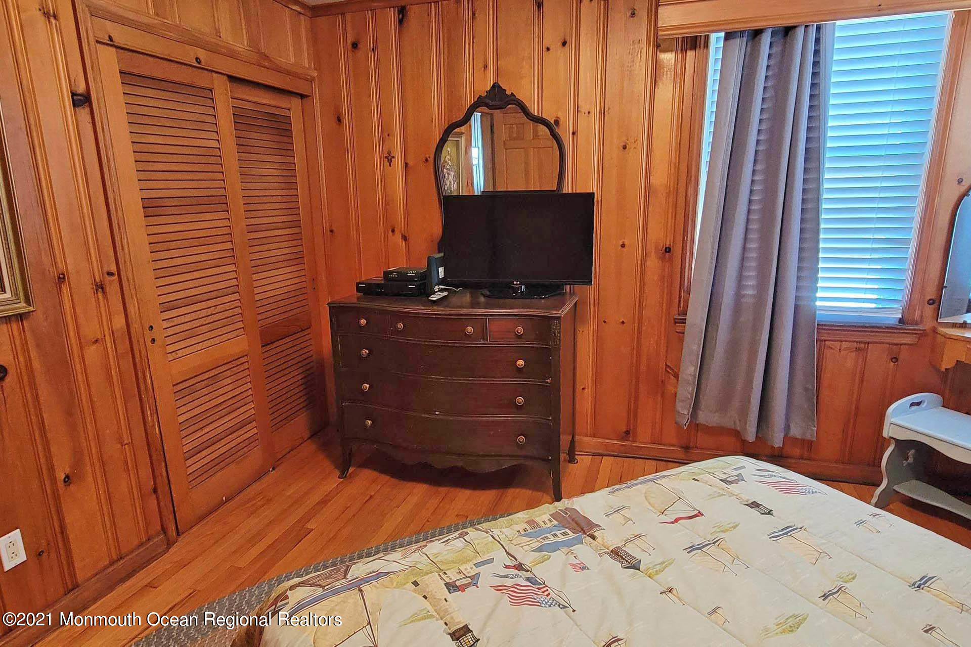 1 Brooklyn Avenue Lavallette, NJ 08735 - Photo 14 of 55 a bedroom with a bed and a flat tv screen on dresser