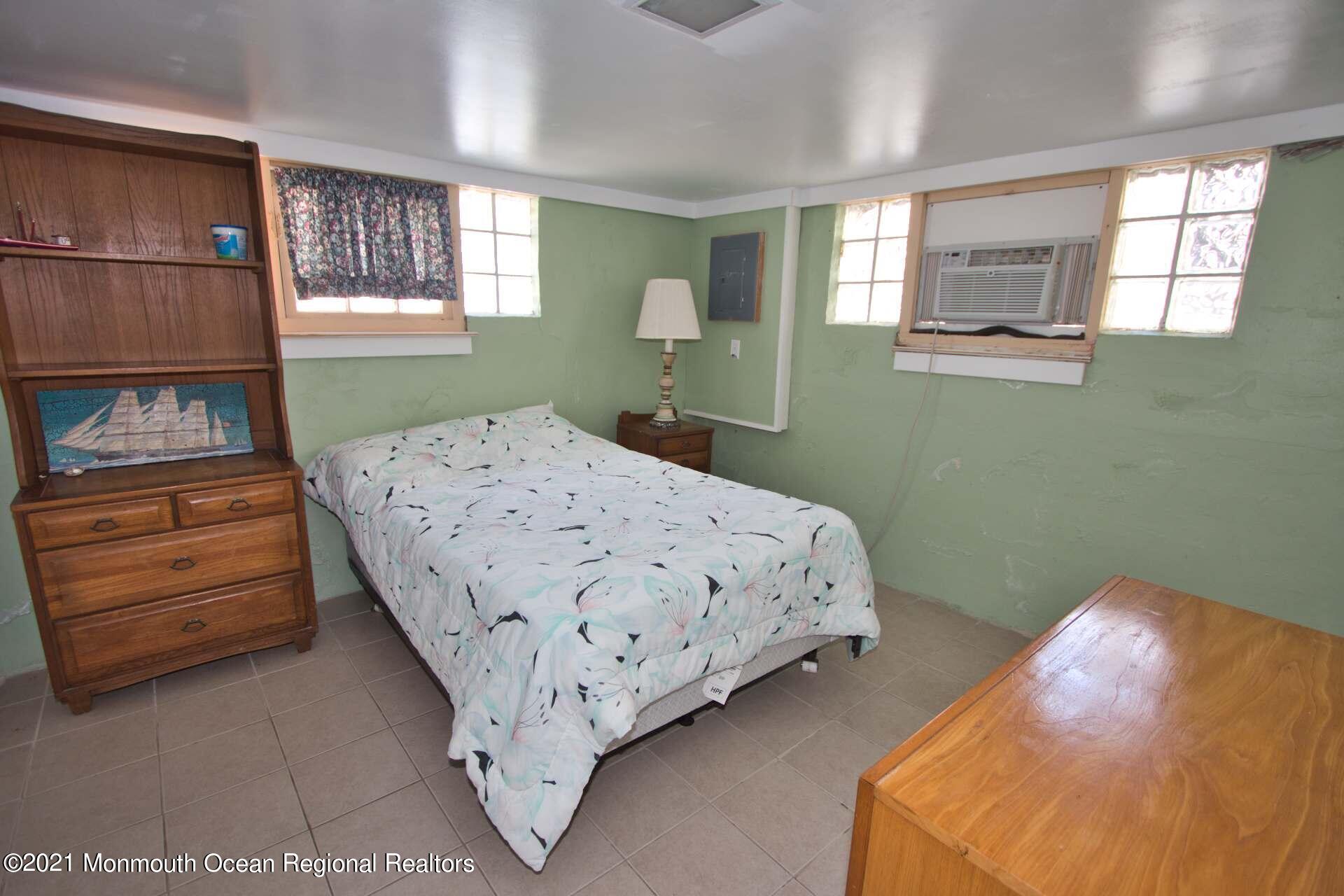 1 Brooklyn Avenue Lavallette, NJ 08735 - Photo 22 of 55 a bedroom with a bed and a window
