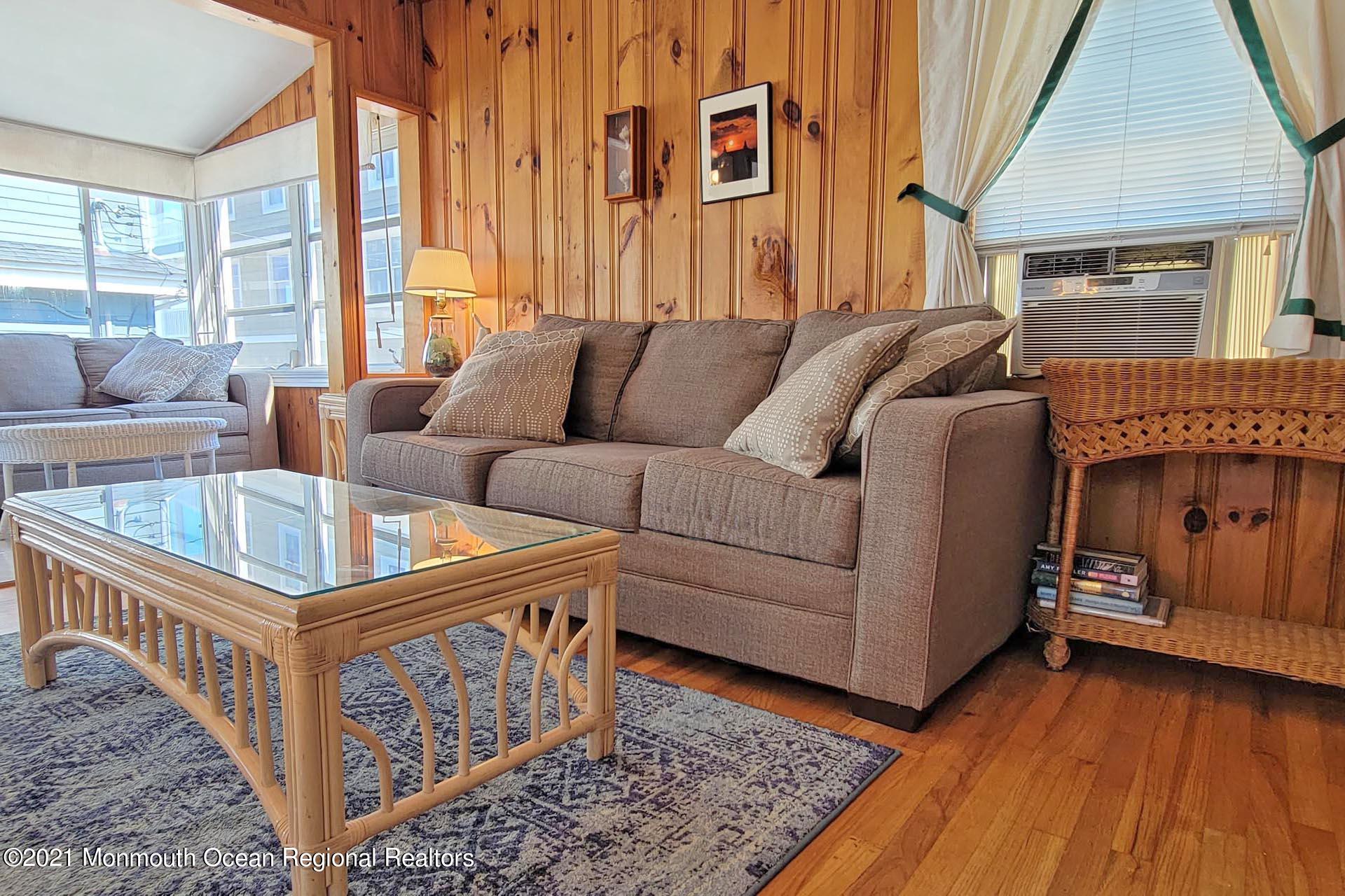 1 Brooklyn Avenue Lavallette, NJ 08735 - Photo 27 of 55 a living room with furniture a couch and large windows