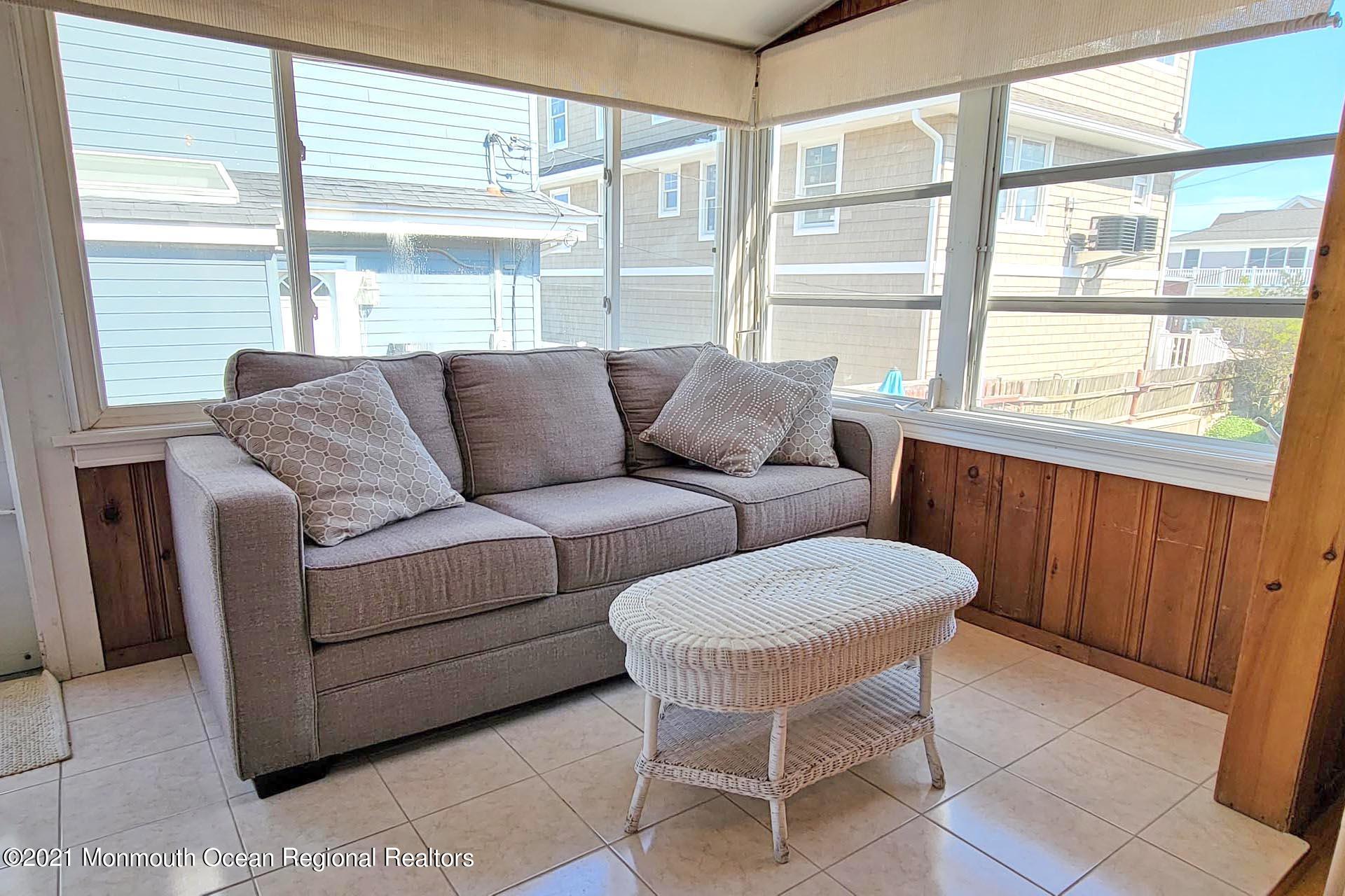 1 Brooklyn Avenue Lavallette, NJ 08735 - Photo 29 of 55 a living room with furniture and a large window