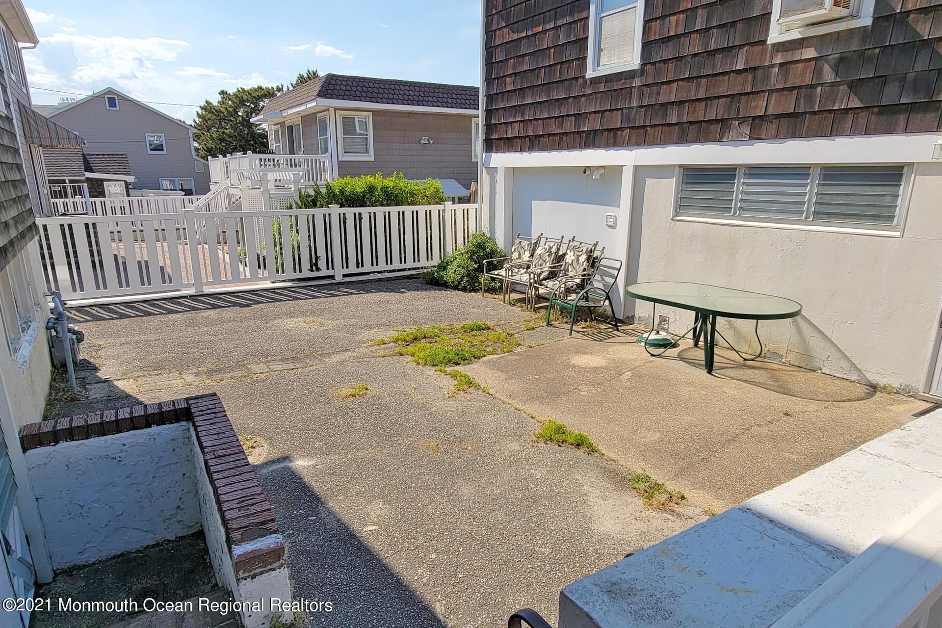 1 Brooklyn Avenue Lavallette, NJ 08735 - Photo 37 of 55 a view of a house with backyard and sitting area