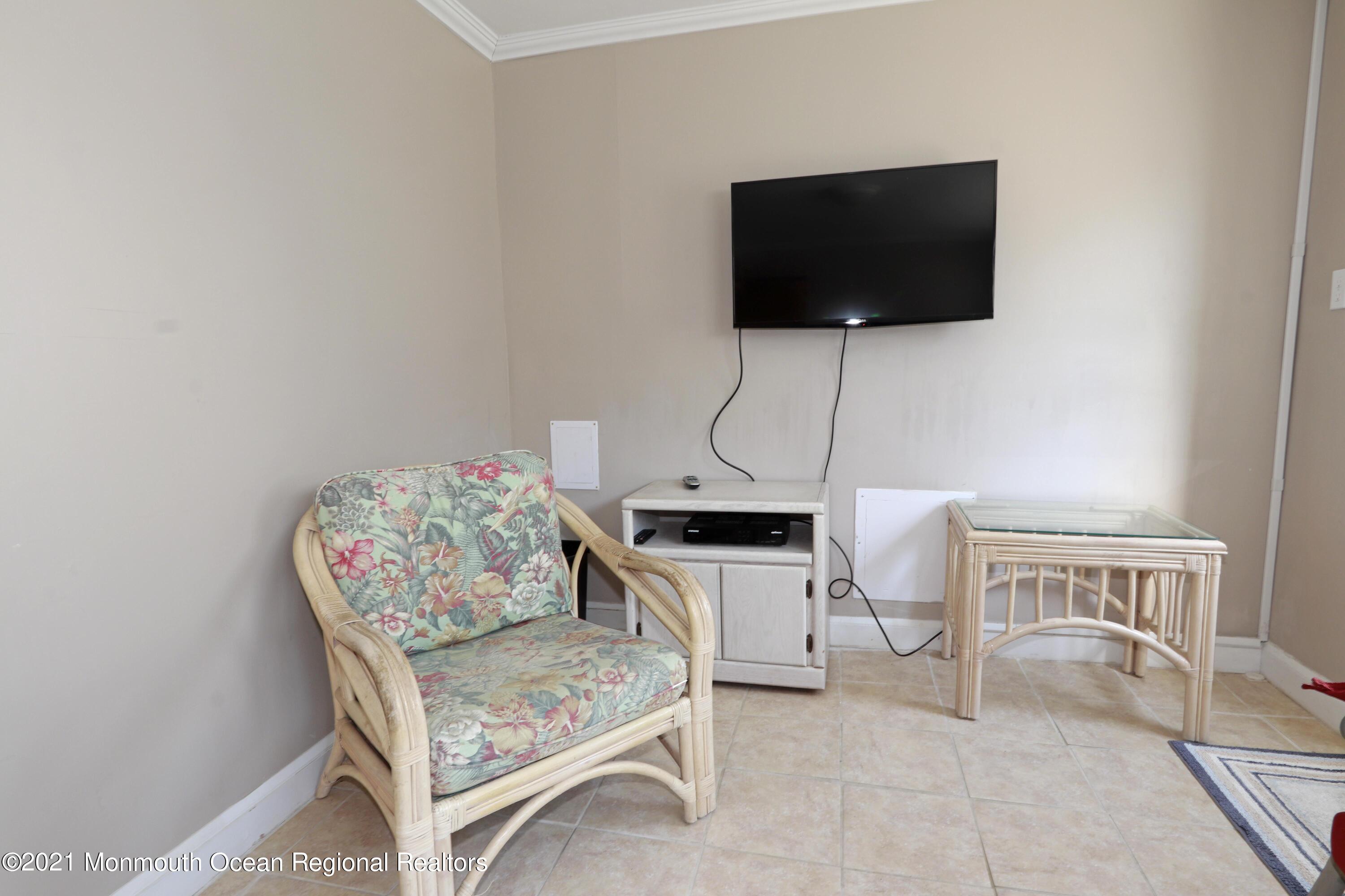 1 Brooklyn Avenue Lavallette, NJ 08735 - Photo 39 of 55 a living room with furniture and a flat screen tv