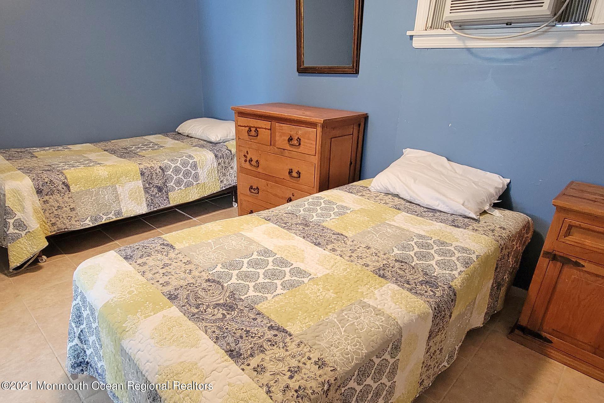 1 Brooklyn Avenue Lavallette, NJ 08735 - Photo 40 of 55 a bedroom with a bed and a window