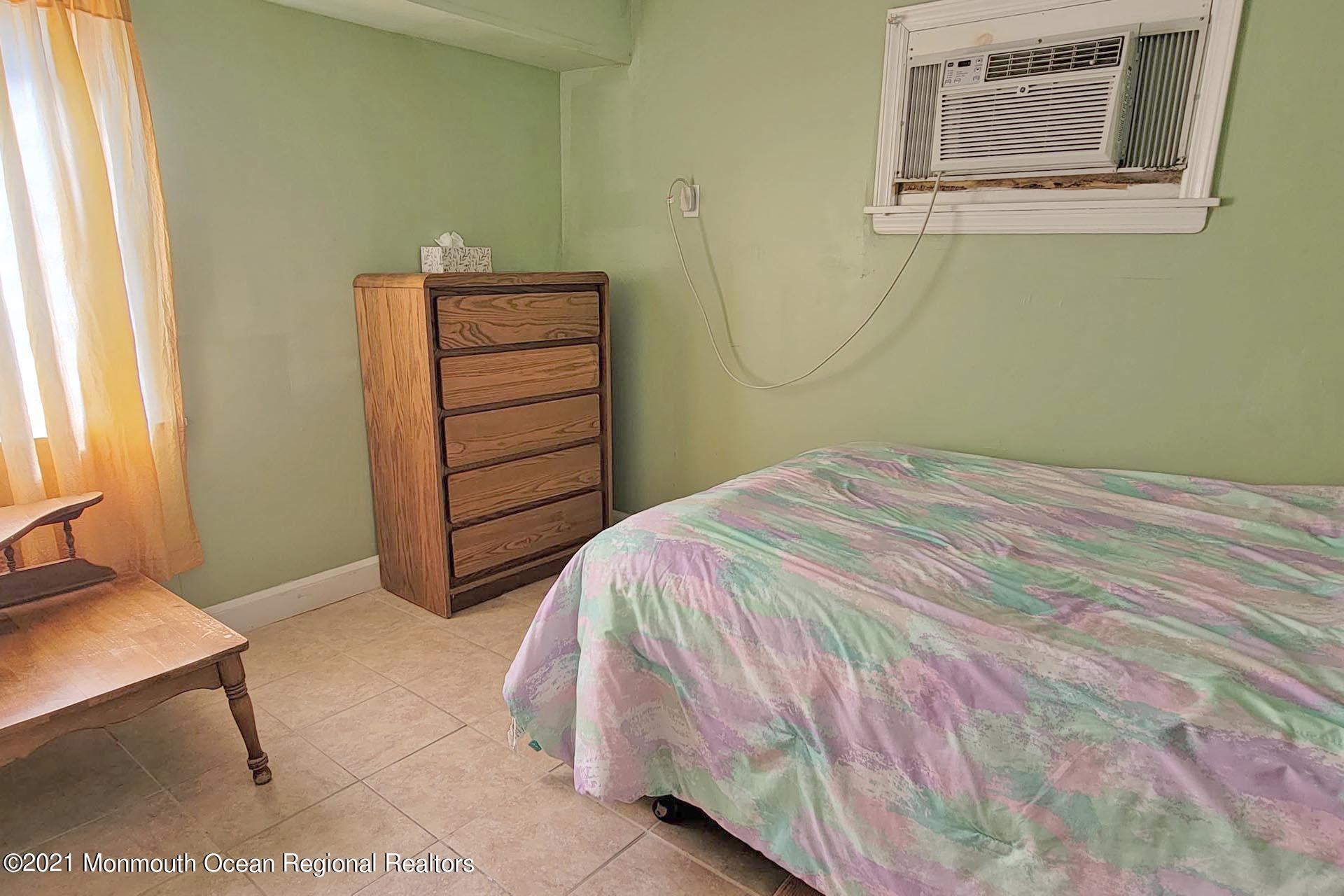 1 Brooklyn Avenue Lavallette, NJ 08735 - Photo 41 of 55 a bedroom with a bed and a window
