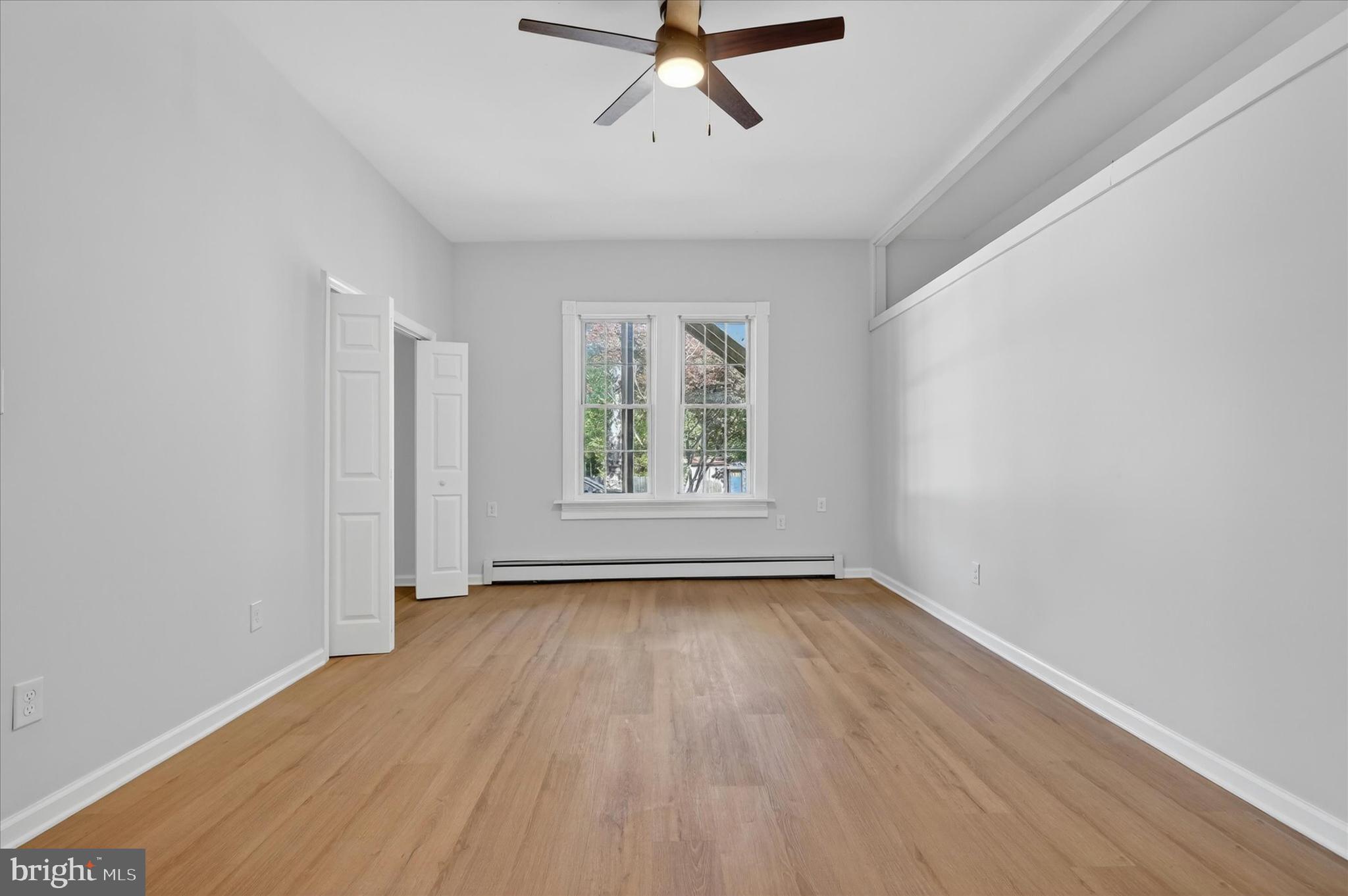 509 Lumberton Road, Unit 1 Hainesport, NJ 08036 - Photo 23 of 33 wooden floor in an empty room with a window