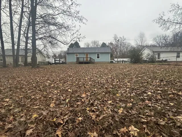 a house with trees in front of it