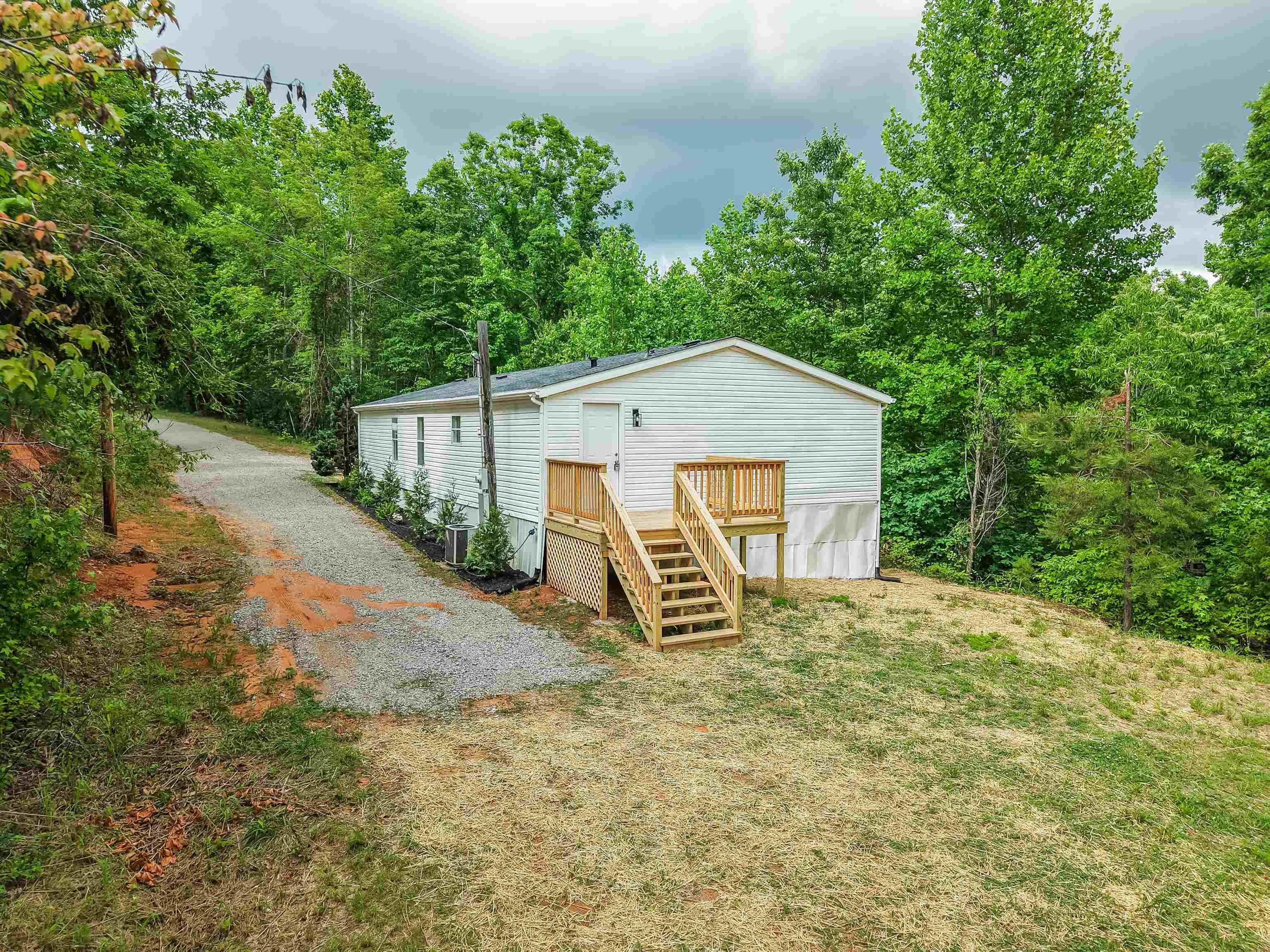 890 Burks Road Savannah, TN 38372 - Photo 3 of 40 a view of a house with backyard and garden