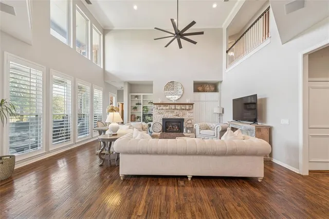 a living room with furniture fireplace and a flat screen tv