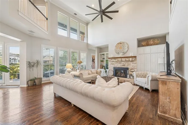 a view of a dining room with furniture a chandelier and wooden floor