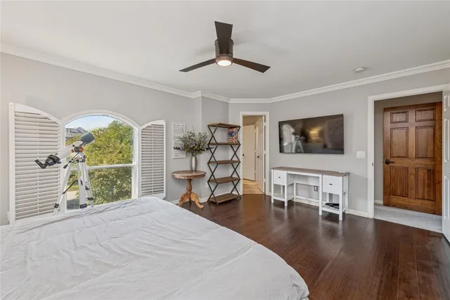 a bedroom with a bed and a chair