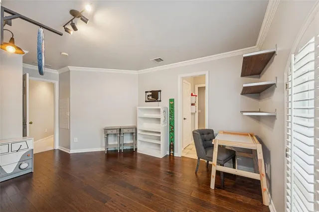 a view of an empty room with a fireplace
