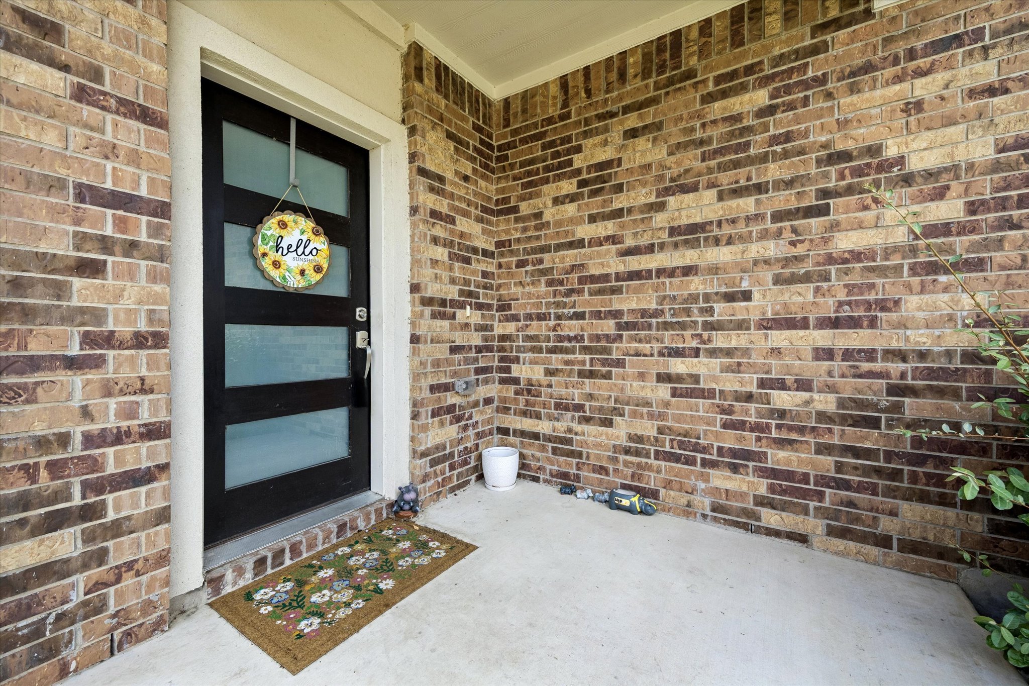 217 Canley Loop Hutto, TX 78634 - Photo 5 of 36 A welcoming entry, with a robust brick exterior, offers a pleasant first impression.