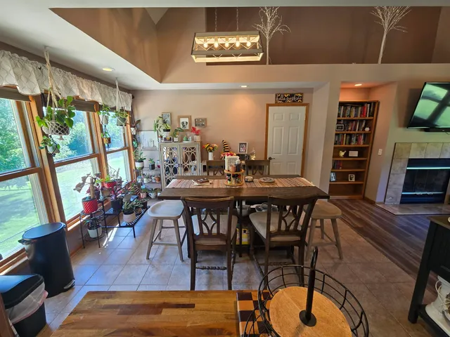 a view of a dining room with furniture window and outside view