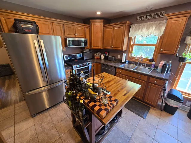 a living room with furniture flat screen tv and a fireplace