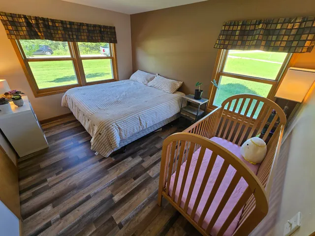 a bedroom with bed and window