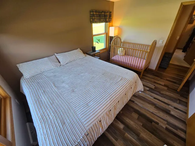 a view of a hallway with workspace and a window