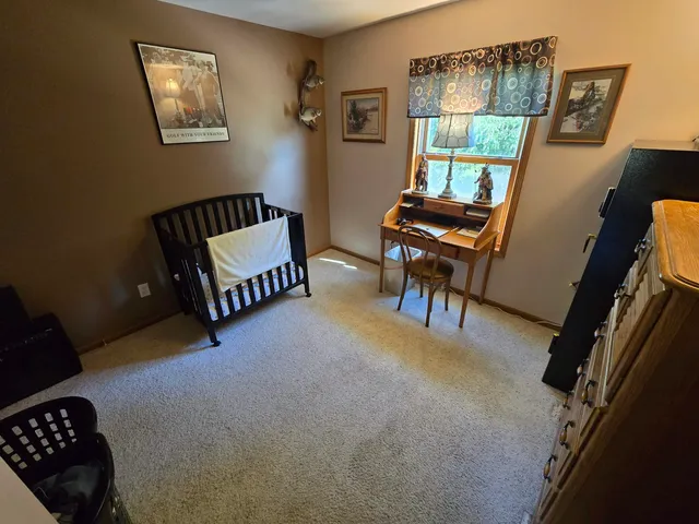 a bathroom with a double vanity sink mirror and toilet