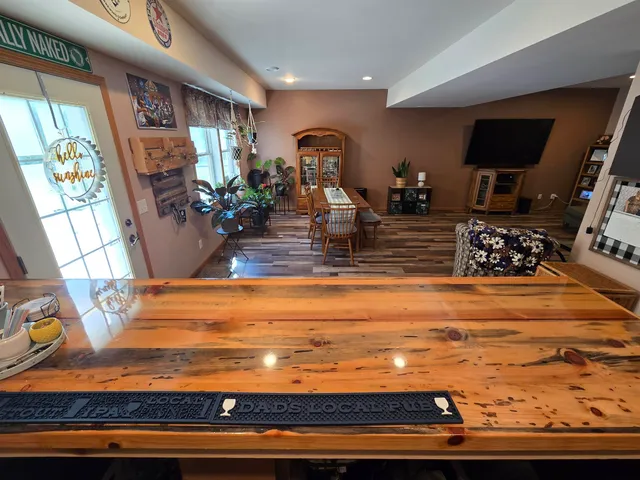 a workspace with furniture window and wooden floor
