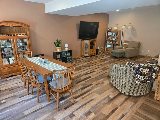 a bed and couch in a room next to a window