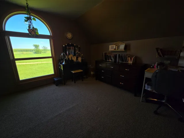 a bathroom with a tub and a window