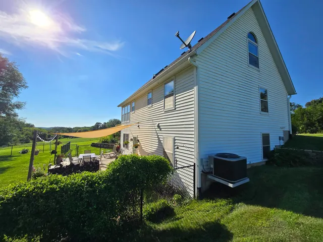 a view of a house with a backyard