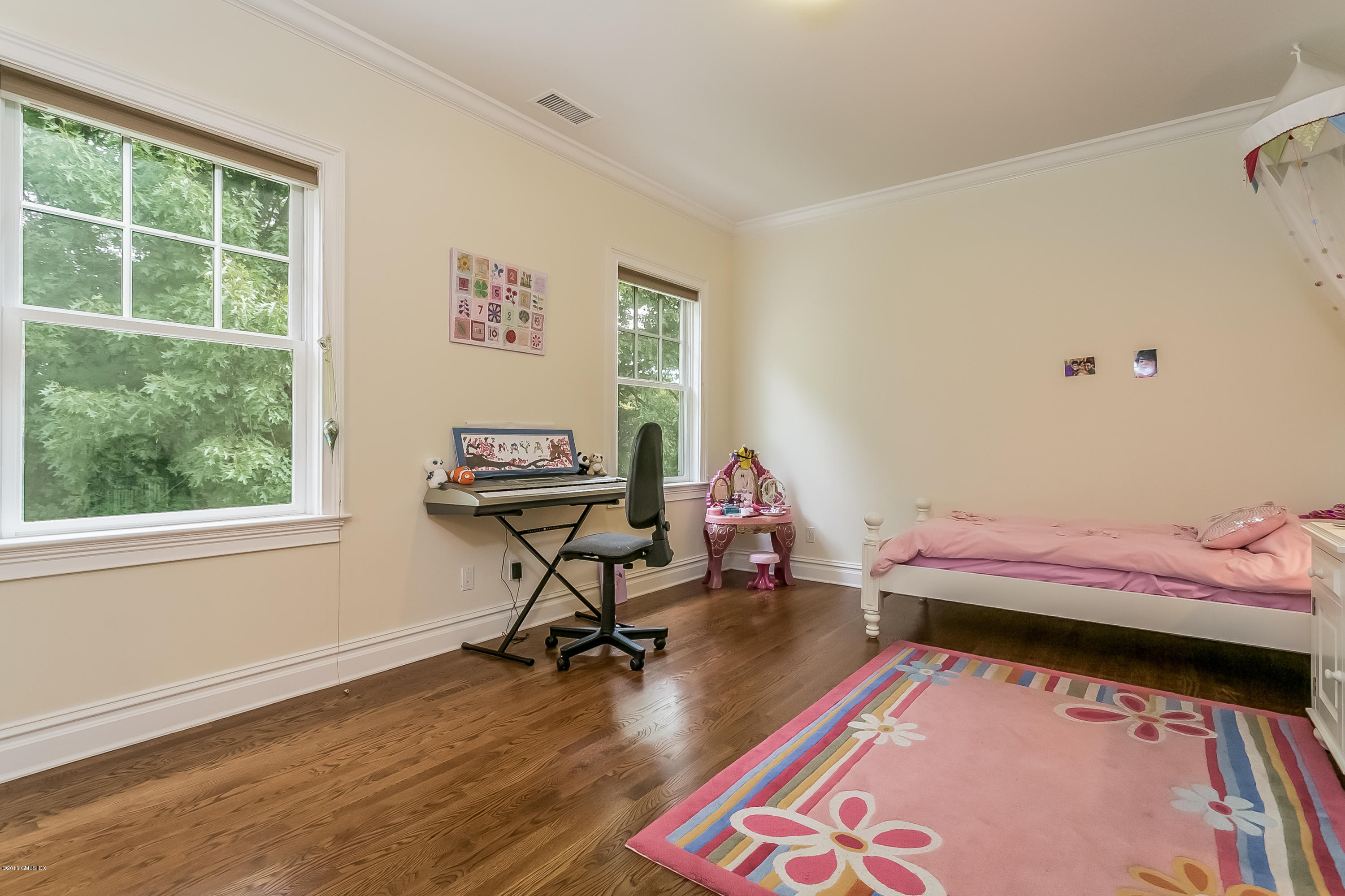 35 Old Orchard Road Riverside, CT 06878 - Photo 29 of 46 a bedroom with a bed and wooden floor