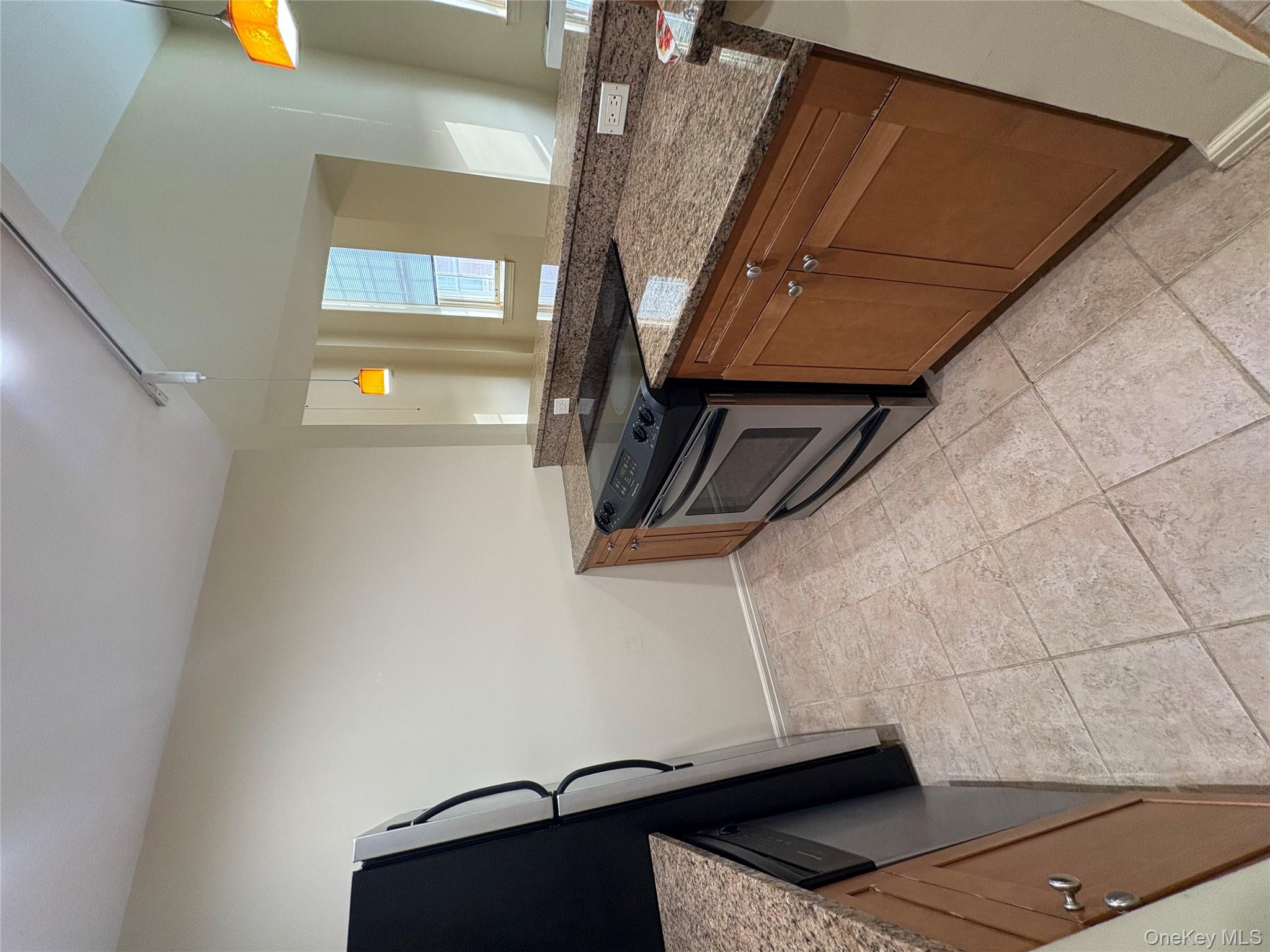 1701 Crompond Road Peekskill, NY 10566 - Photo 3 of 15 a kitchen with a stove top oven and cabinets