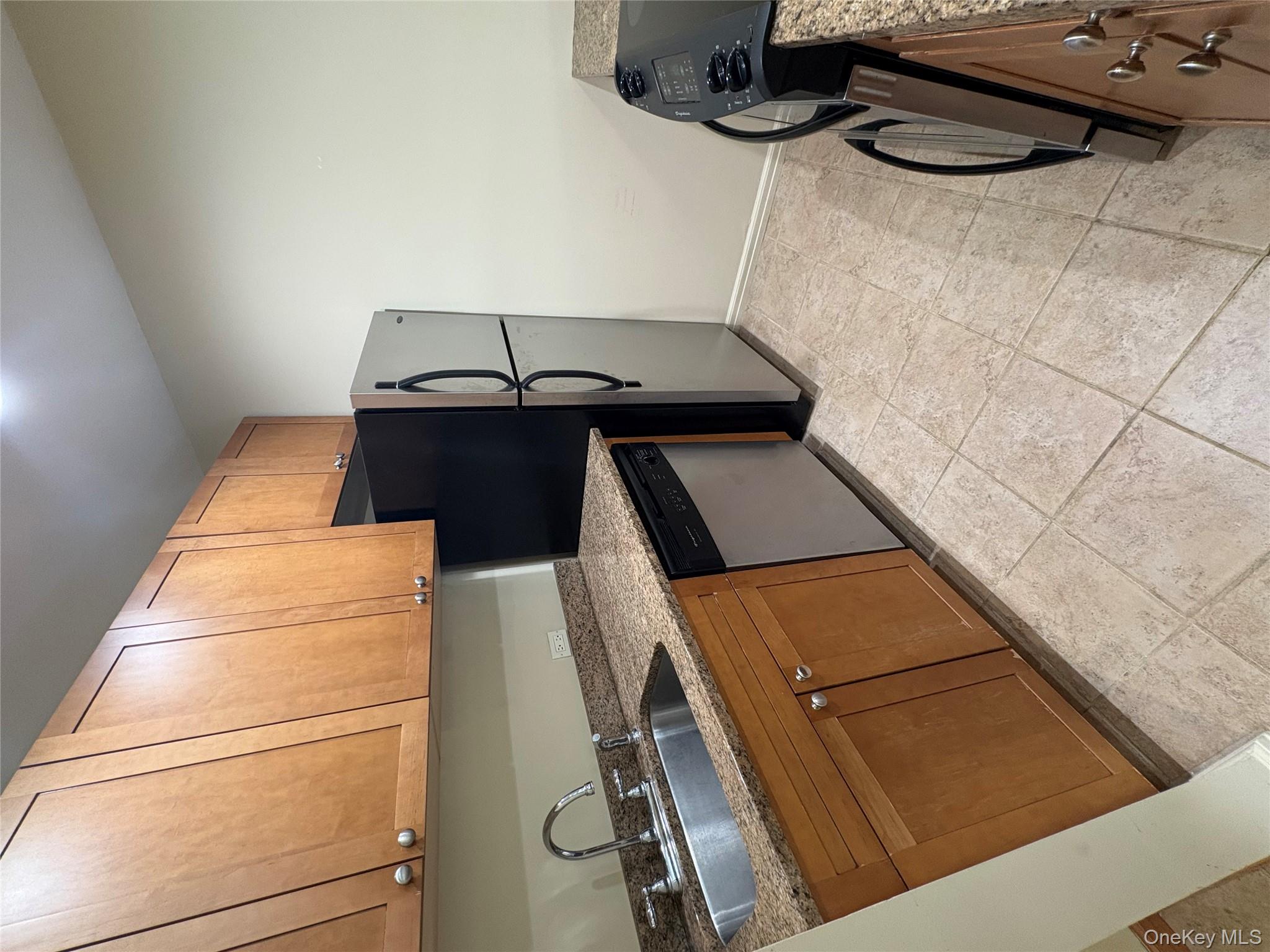 1701 Crompond Road Peekskill, NY 10566 - Photo 4 of 15 a kitchen with a sink cabinets and appliances