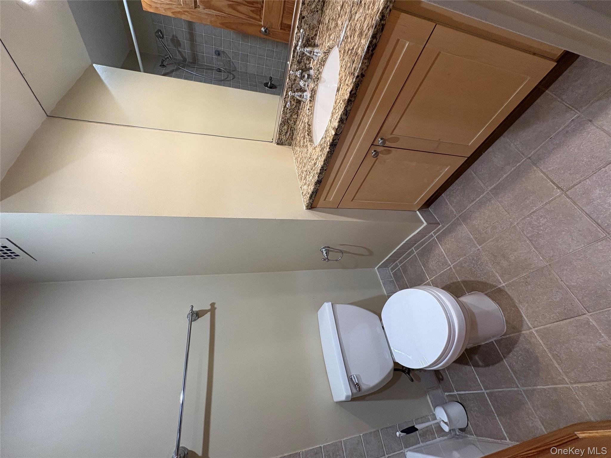 1701 Crompond Road Peekskill, NY 10566 - Photo 8 of 15 a bathroom with a granite countertop toilet and a sink