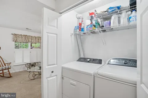 a balcony with wooden floor and fence