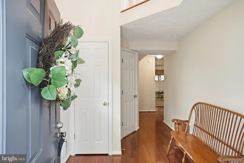 a balcony with wooden floor and fence