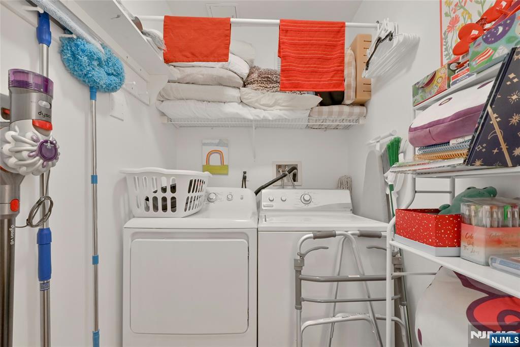 189 Forest Avenue, Unit 117 Paramus, NJ 07652 - Photo 12 of 15 a utility room with dryer and washer
