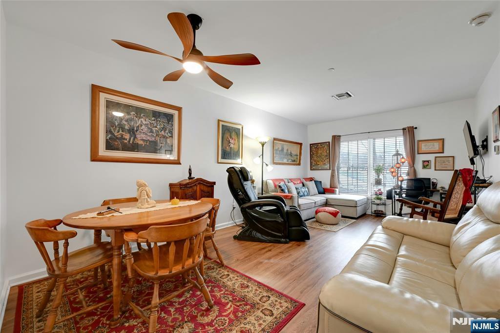 189 Forest Avenue, Unit 117 Paramus, NJ 07652 - Photo 7 of 15 a living room with furniture