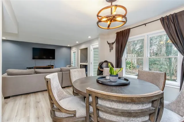 a view of a dining room with furniture window and wooden floor