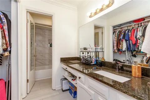a kitchen with stainless steel appliances granite countertop a sink and a refrigerator
